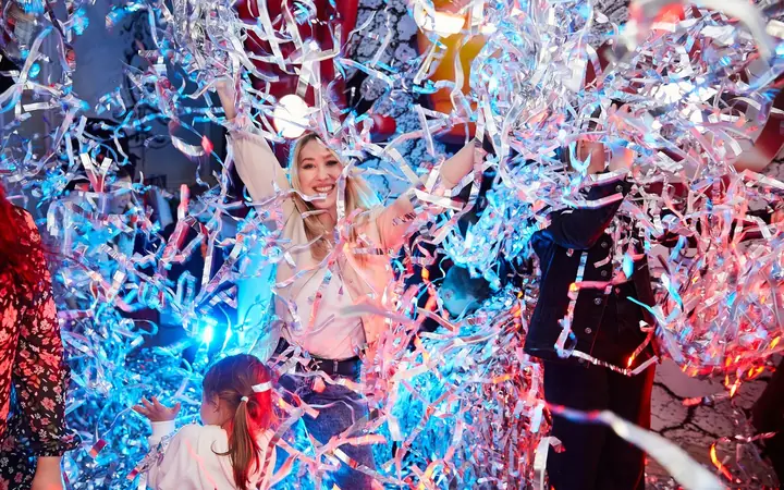 Children in the silver ribbon shower of the Silver Show